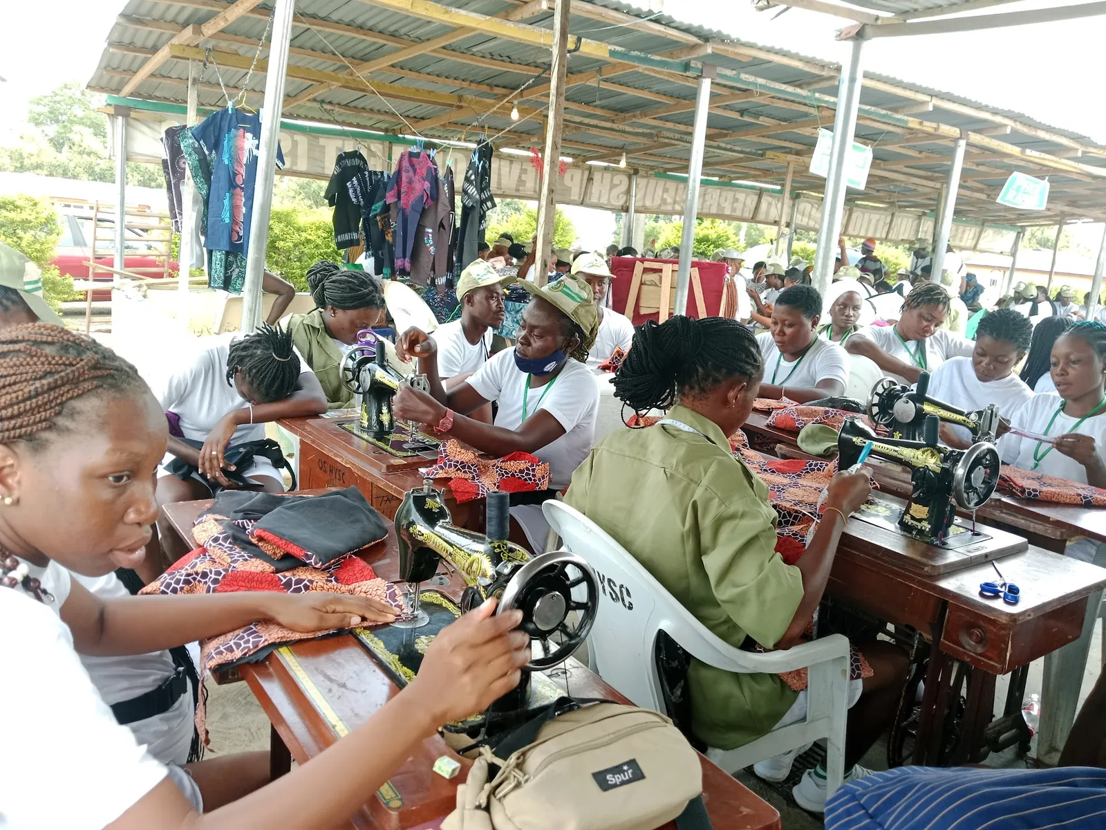 Corps members learning to sew
