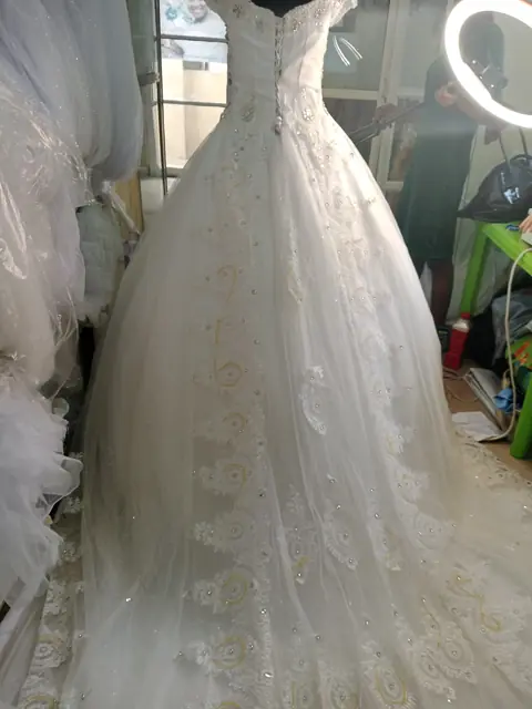 Full-length lace ball gown with cathedral skirt